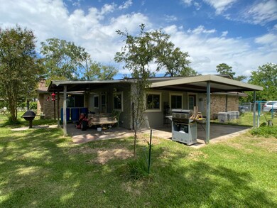 Covered patio space with rain catchers at the gutters