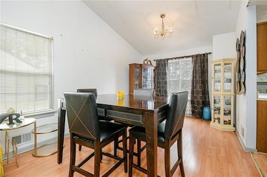 Dining space with lofted ceiling, plenty of natura