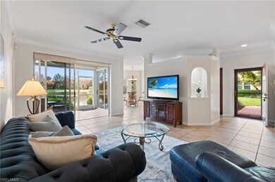Living room featuring ceiling fan with notable cha