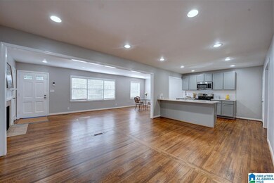 Living area features gorgeous original hardwood fl