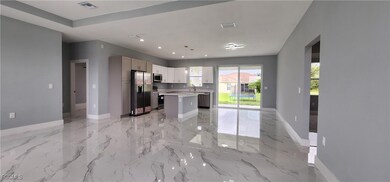 Kitchen with light countertops, stainless steel ap