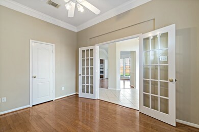 The home office is conveniently located off the foyer, opposite the formal dining room.