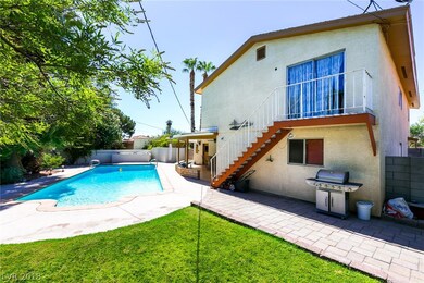 Beautiful lawn, sparkling pool, pavers, stamped co