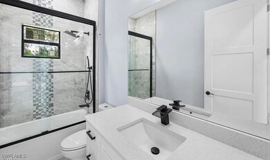 Bathroom featuring vanity and bath / shower combo