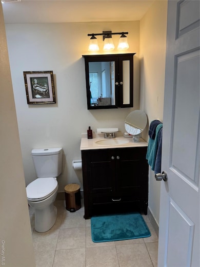 Bathroom featuring vanity and light tile patterned floors