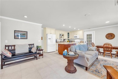 Living room with recessed lighting, visible vents,
