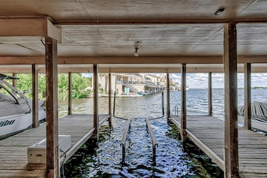 Dock with a water view and boat lift