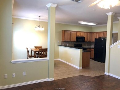 Kitchen featuring ornate columns, ornamental moldi