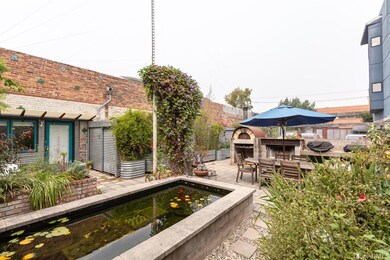 Koi pond, outdoor fireplace, seating area