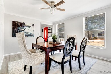 Dining space with light hardwood / wood-style floo