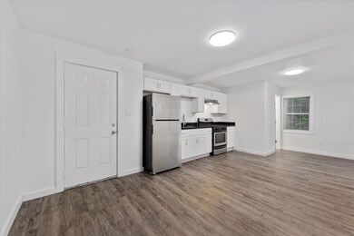Open concept kitchen area with full sized applianc