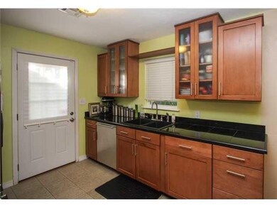 Kitchen. Remodeled kitchen! Gas stove 2 months old! The tile floors are porcelain tile not just ceramic. Black granite tiled countertops.