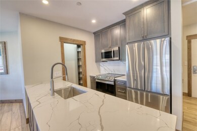 Kitchen featuring tasteful backsplash, lvp floorin