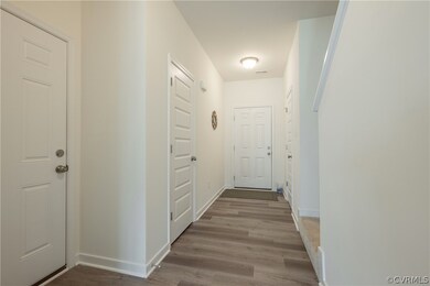 Corridor featuring hardwood / wood-style floors