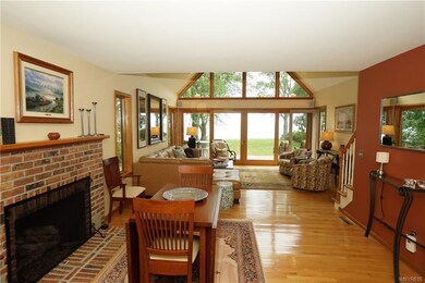 Dining room with gas fireplace opens up to invitin