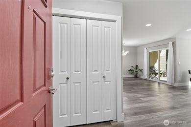 Entryway with spacious closet & open concept living.