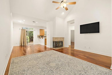 Living area featuring wood finished floors, ceili