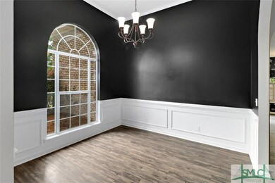 Formal dining room with wainscoting and chair rail