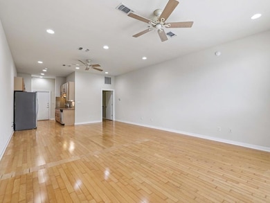 Unfurnished living room with ceiling fan, light w