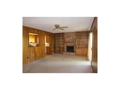 Features include built-ins and a handsome floor-to