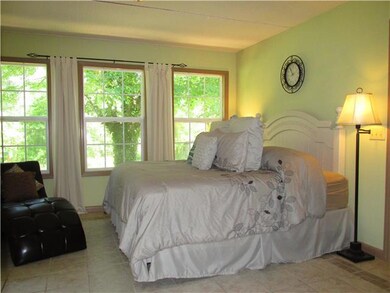 Beautiful Master w/custom walk in closets. Tile floors & a view of the private backyard area.