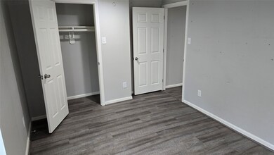 Bedroom 1 with open closet door