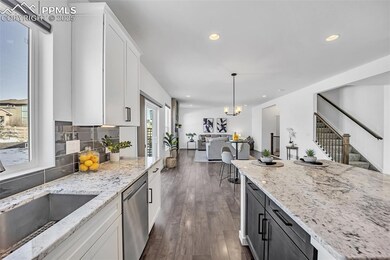 Kitchen with light stone countertops, decorative l