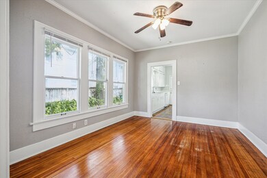 The wood floors extend through the dining room
