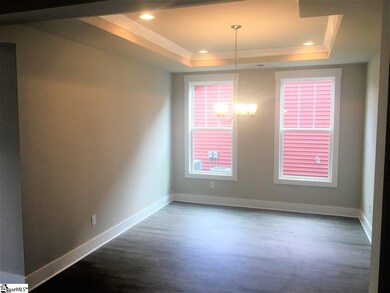Formal Dining Room with a tray ceiling
