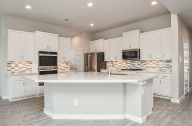This view of your gorgeous, relaxing chef's kitchen is almost museum worthy! Structural balance and symmetry make tasking, stocking goods, prepping and serving a breeze.
