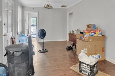 Interior space with wood-type flooring, crown mold