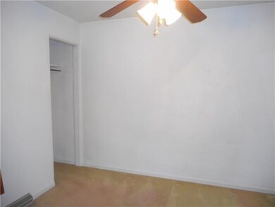 Bedroom with wall to wall carpet.
