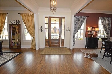 ELEGANT FRONT ENTRY WITH HARDWOODS, TONS OF WINDOW