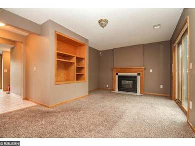 Gas fireplace, built-ins, and walk-out in living r