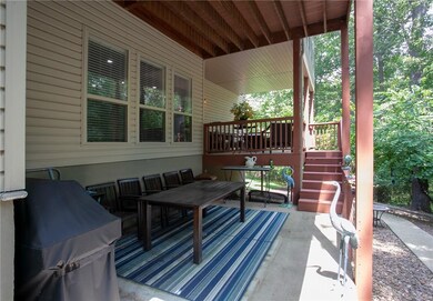 Lower level patio and walkway with private, landscaped back yard.