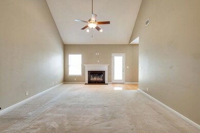 Enjoy this large family room with wood burning fireplace, vaulted ceiling and direct access to wonderful backyard.