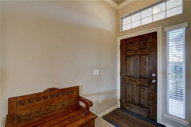 Beautiful stained wood door and spacious entry!