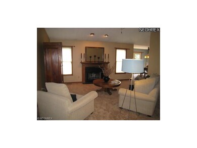 Great room with cathedral ceilings and fireplace.