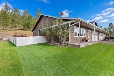 Enjoy the privacy of a fenced yard with mountain views