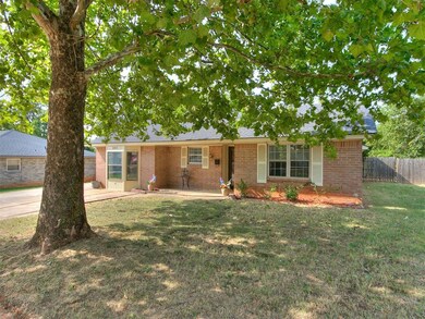 Ranch-style home with a front yard