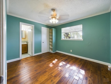 Unfurnished bedroom featuring wood-type flooring,