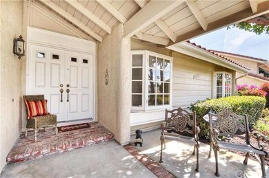 Lovely covered entry with brick accents.  Get read