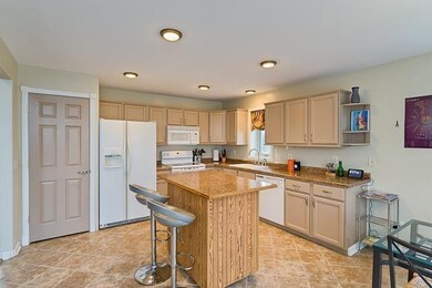 Open Kitchen with Tile Floor and Island