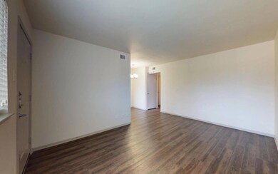 Spare room featuring dark hardwood / wood-style fl