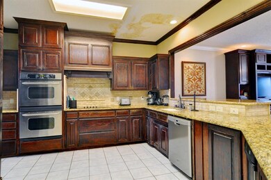 Kitchen with stainless steel appliances and open t