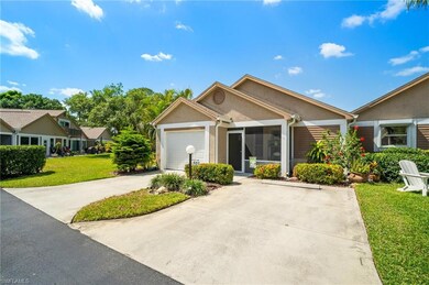 Single story home featuring driveway, stucco siding, a front lawn, and an attached garage