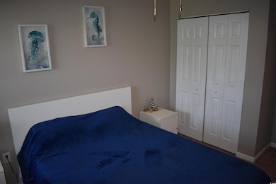 Bedroom featuring a closet and baseboards