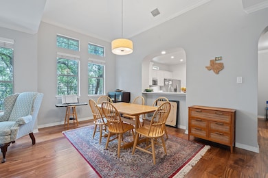 Dining area with arched walkways, plenty of natur