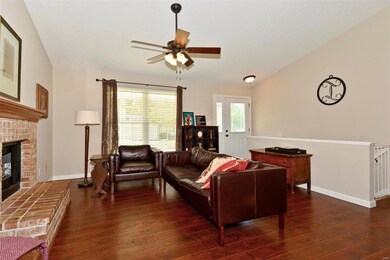 Wonderful living space with fireplace, ceiling fan