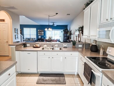 Kitchen with white appliances, kitchen peninsula, 